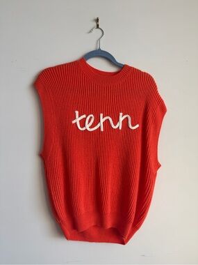 Orange knit “Tenn” sweater